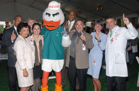 UM Miller School executives and hospital officials hosted a week of activities to welcome employees to the new University of Miami Hospital. Pictured from left, back row: Darryl Caulton, CFO; Susie Lambert, COO; and Errol Douglas, human resources director. Front row: Fran Allen, associate vice president for regulatory compliance; Silvia Stradi, chief nursing officer; Sebastian the Ibis; Anthony Degina, CEO; Michele Chulick, associate vice president and director of hospital operations; and Dean Pascal J. Goldschmidt, M.D.