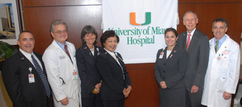UM Miller executives and hospital officials hosted a morning of festivities Monday to welcome employees to the new University of Miami Hospital. Pictured at the celebration, from left, Tony Degina, CEO; William O’Neill, M.D., executive dean for clinical affairs; Michele Chulick, associate vice president and director of hospital operations; Fran Allen, associate vice president for regulatory compliance; Silvia Stradi, chief nursing officer; William J. Donelan, vice president for medical administration; and Dean Pascal J. Goldschmidt, M.D.