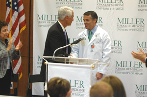 Dean Pascal J. Goldschmidt, M.D., shakes hands with Governor Charlie Crist after he made the official announcement that UM will be granted $80 million for genetics research.