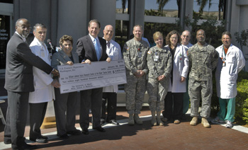 The Miller School received a total of $4.8 million in federal funding from Congressman Lincoln Diaz-Balart at a news conference Monday. Above, several members of the Army Trauma Training Center team and UM/Jackson leadership were on hand for the event, including from left, Marvin O’Quinn, Jackson Health System president and CEO; Dean Pascal J. Goldschmidt, M.D.; UM President Donna E. Shalala; Diaz-Balart; and Jeffrey Augenstein, M.D., Ph.D., director of the William Lehman Research Center and director of Ryder Trauma Center