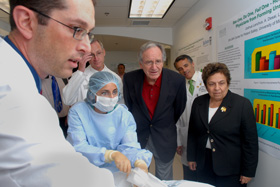 David Birnbach, M.D., M.P.H., U.S. Senator Tom Harkin, Dean Pascal J. Goldschmidt, M.D., and President Donna E. Shalala observe as Joshua Lenchus, D.O., instructs a medical student as she inserts a central line in the neck of a mannequin at the UM-JMH Center for Patient Safety.