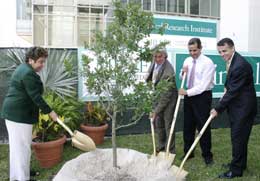 (from left) President Donna Shalala, Paul Polizzotto from EcoMedia, Miami Mayor Manny Diaz and Miller School Dean Dr. Pascal Goldschmidt plant a tree to officially mark the creation of the new Miami Health District.