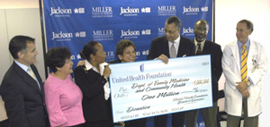 Reed V. Tuckson, M.D., member of the board of directors of United Health Foundation (third from right), presented a $1million check to UM’s Department of Family Medicine to further care at Jefferson Reaves, Sr. Health Center. Also, from left: Dean Pascal J. Goldschmidt, M.D., Rocio Quintero, M.D., Jefferson Reaves acting medical director; Barbara K. Loyd, Jefferson Reaves administrator; UM President Donna E. Shalala; Marvin O’Quinn, Jackson Health System president and CEO; and Robert Schwartz, M.D., chairman of the Department of Family Medicine.