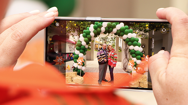 Guests of this year's School of Communication Homecoming celebration pose for a photo.